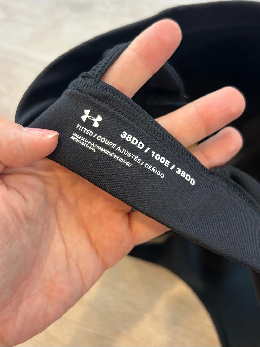 Under Armour black sports bra with zipper in size 38DD